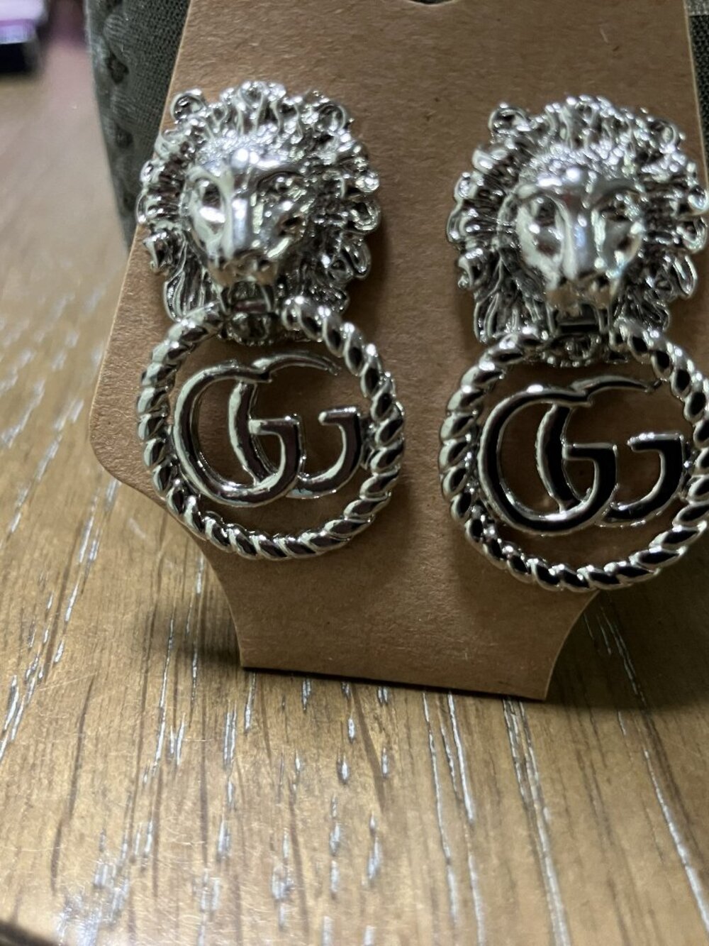 Woman's Silver Earrings with Lions Head